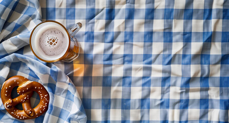 beer and pretzel on background, bavarian blue white pattern tablecloth, blank space for text, octoberfest