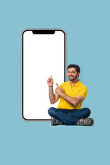 Full size Indian asian man with blank screen mobile, isolated pastel background