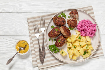 frikadeller, danish meatballs on a plate, top view