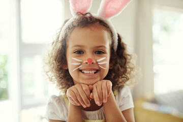 Home, portrait and girl with creative for bunny ears, decoration and costume for cosplay with child. Happy kid, face paint and playful art for tradition, festive celebration and easter with acting