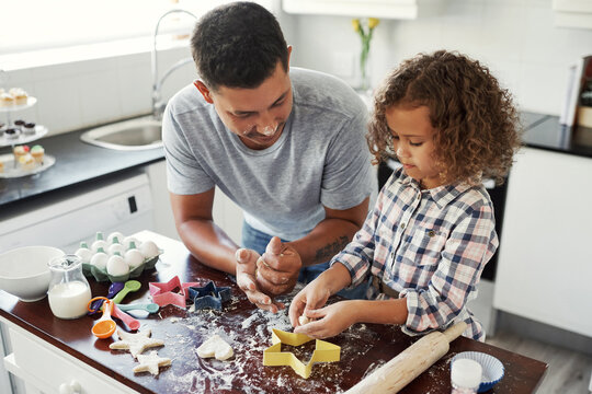 Baking, dad and girl in kitchen, love and teaching with support, ingredients and time together. Happy family, parent or father with daughter in house, learning or dough with utensils or cookie cutter - Powered by Adobe