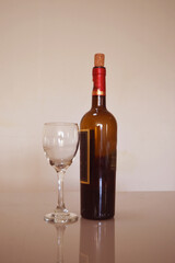 a glass and a bottle of liquor