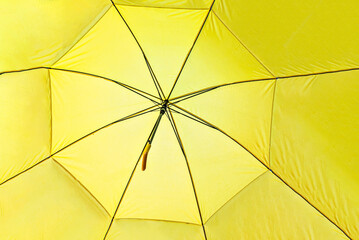 Open large yellow umbrella. Abstract