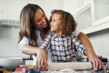 Woman, kid and baking in kitchen with roller on counter for pastry recipe, support and teaching at home. Happy, mother and daughter with flour on dough for ingredients, learning and love together