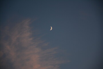 Crescent moon, blue sky and clouds