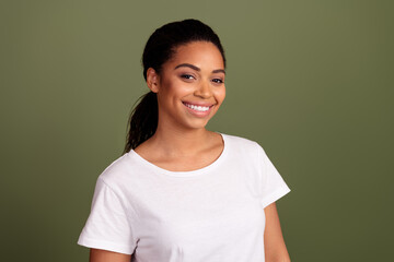 Portrait of pretty young woman beaming smile wear white t-shirt isolated on khaki color background