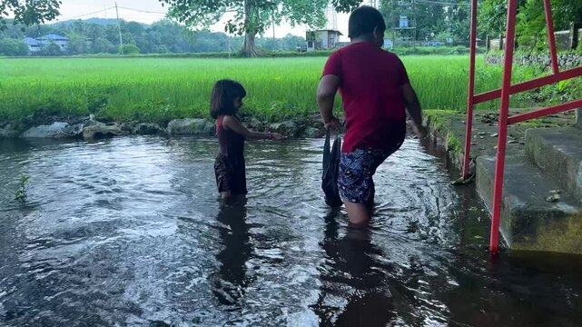 Fishing and Playing in Paddy Water Field