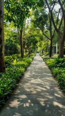 Obraz premium Lush Green Sidewalk Surrounded by Vibrant Flora: The Ideal Choice for Sustainable Urban Planning and Eco-friendly Cityscapes