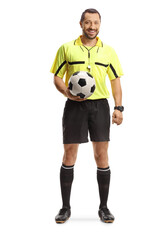 Football referee holding a ball and smiling