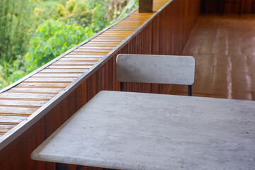 View of wooden table and wooden chairs in the villa