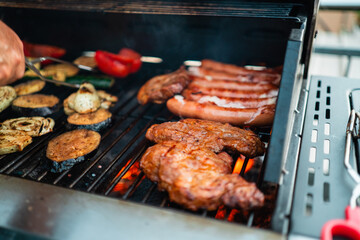 Ready Steaks and Vegetables Barbecue Food Roasted over the Hot Glowing Ember Flames on a Gas Grill During Grill Season