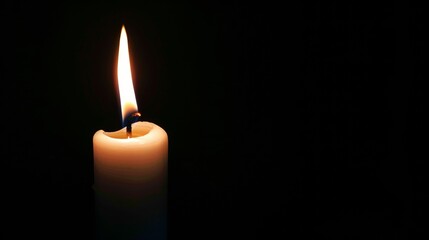 Single White Candle Burning in Darkness