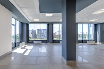 Fototapeta premium panorama view in empty modern hall with columns, doors and panoramic windows.