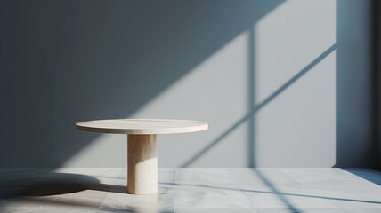 Fototapeta premium A high-quality image of a marble round table against a grey background. The minimalist setup centers the table, ensuring a clean and simple layout that provides plenty of space for product displays. 
