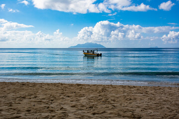 Calm Ocean with a floating boat at Seychelles 