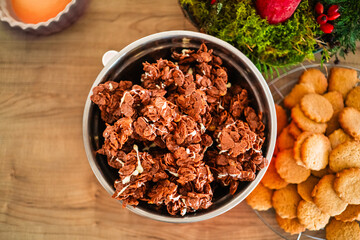 Bowl of Delicious Crispy Choclate Chip Cookies with White Choclate Decoration Freshly Baked for Christmas in the Bakery Top Down View