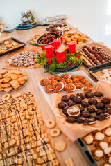 Batches of Cookies Macroons Biscuites and Pastry Placed on the Bakery Kitchen Table Top Fresh from the Oven on Advents