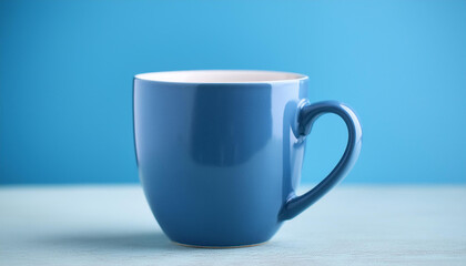 Blue ceramic cup against blue backdrop. Drink ware. Mug for hot beverage. Mock-up.