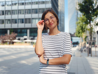 Fototapeta premium Asian woman over background of modern urban architecture in Vienna.