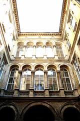 Historic building with arched windows and intricate architectural details. Budapest, Hungary