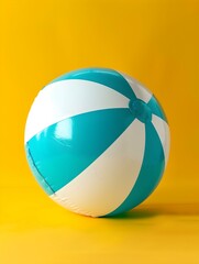 Turquoise and White Beach Ball on a yellow Background. Summer Wallpaper