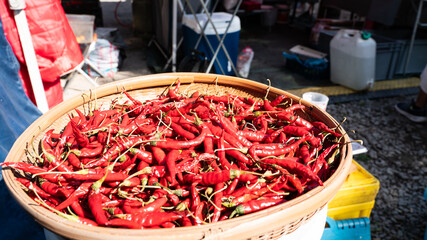 Basket full of red chillies at Thai Food market