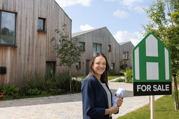 Real estate agent at an open house for a eco home