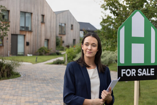 Real estate agent selling a new build home