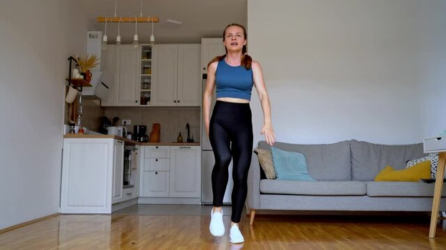 Video athletic woman 36 years old, doing  intense cardio workout at home.