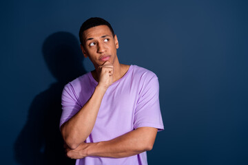 Photo of young funny guy with short haircut wear stylish purple t shirt touch chin thoughtful...