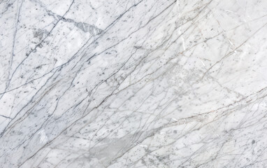 Fototapeta premium Close-up view of a grey and white marble texture with natural veining patterns, suitable for background or design elements.