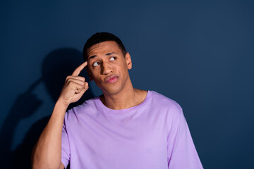 Photo portrait of young funny guy with short haircut wear stylish purple t shirt touch head deep...