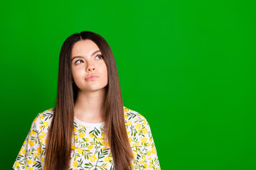 Photo portrait of pretty teen girl look skeptical empty space wear trendy flowers print outfit...