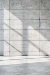 Minimalistic concrete wall with natural shadows, creating a modern and industrial look, perfect for backgrounds or architectural designs.