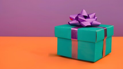 Obraz premium Bright green colored cardboard box with purple bow and ribbons placed on orange table against violet background. 