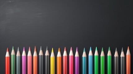 A row of colored pencils on a black background