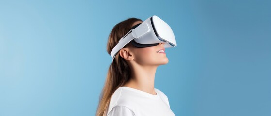Young woman using virtual reality headset on plain background