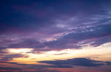 Dramatic dark moody purple and orange sunset sky. Natural background