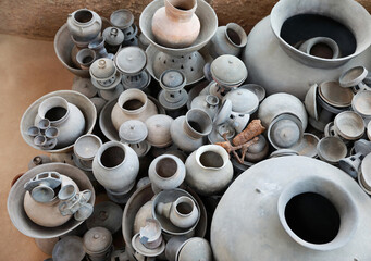 Bokcheon-dong, Dongrae-gu, Busan, South Korea - July 20, 2023: Close-up and top angle view of stacked earthenware on the floor at museum of Bokcheon-dong Ancient Tomb
