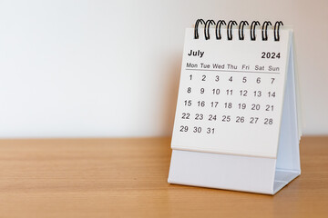 2024 calendar - July month page on the wooden desk