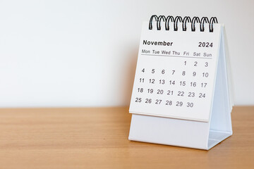 2024 calendar - November month page on the wooden desk