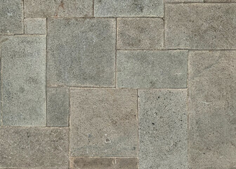 Square grey honed paving stone made of natural cobbles stone for outdoor pavement or car port floors.
