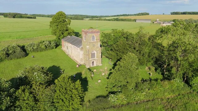 Aerial drone footage of a small Lincolnshire village called Burwell in the UK. Typical English rural village scene. St Michael's Church