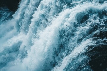 Close-up of a cascading waterfall, capturing the power and energy of the rushing water