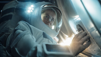 Close-Up Portrait of Professioanal Astronaut Performing a Routine Maintenance Check Outside a Spacecraft in Zero Gravity in Outer Space. Technology, Scientific Exploration, Female Empowerment Concept