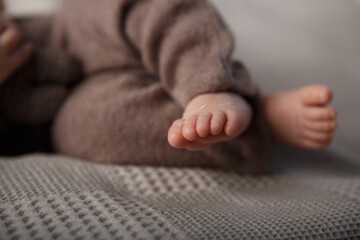 Newborn baby's feet on the background