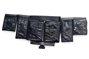 Old laptop battery on a white background