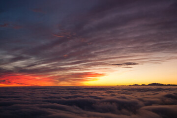 Spectacular sunset over a sea of clouds