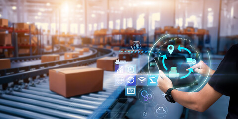 Business Logistics management technology concept.Man hands using tablet on blurred  Distribution Warehouse