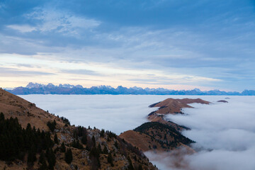 Mountain peaks emerging from the clouds